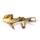 A gold 'prospector' brooch,
