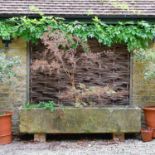 A large Cotswold stone trough