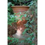 A Whichford Pottery terracotta pot and stand,