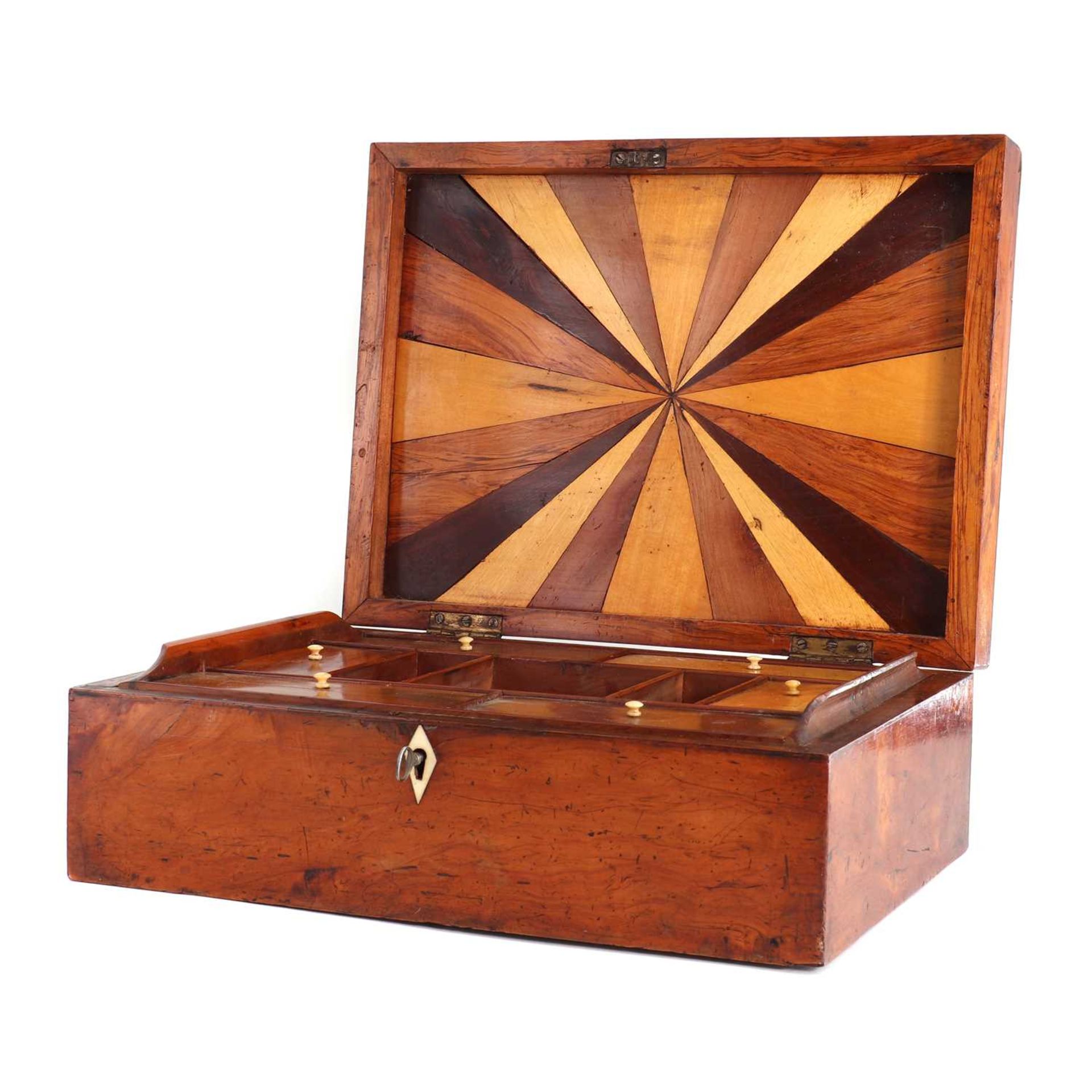 A specimen wood sewing box,