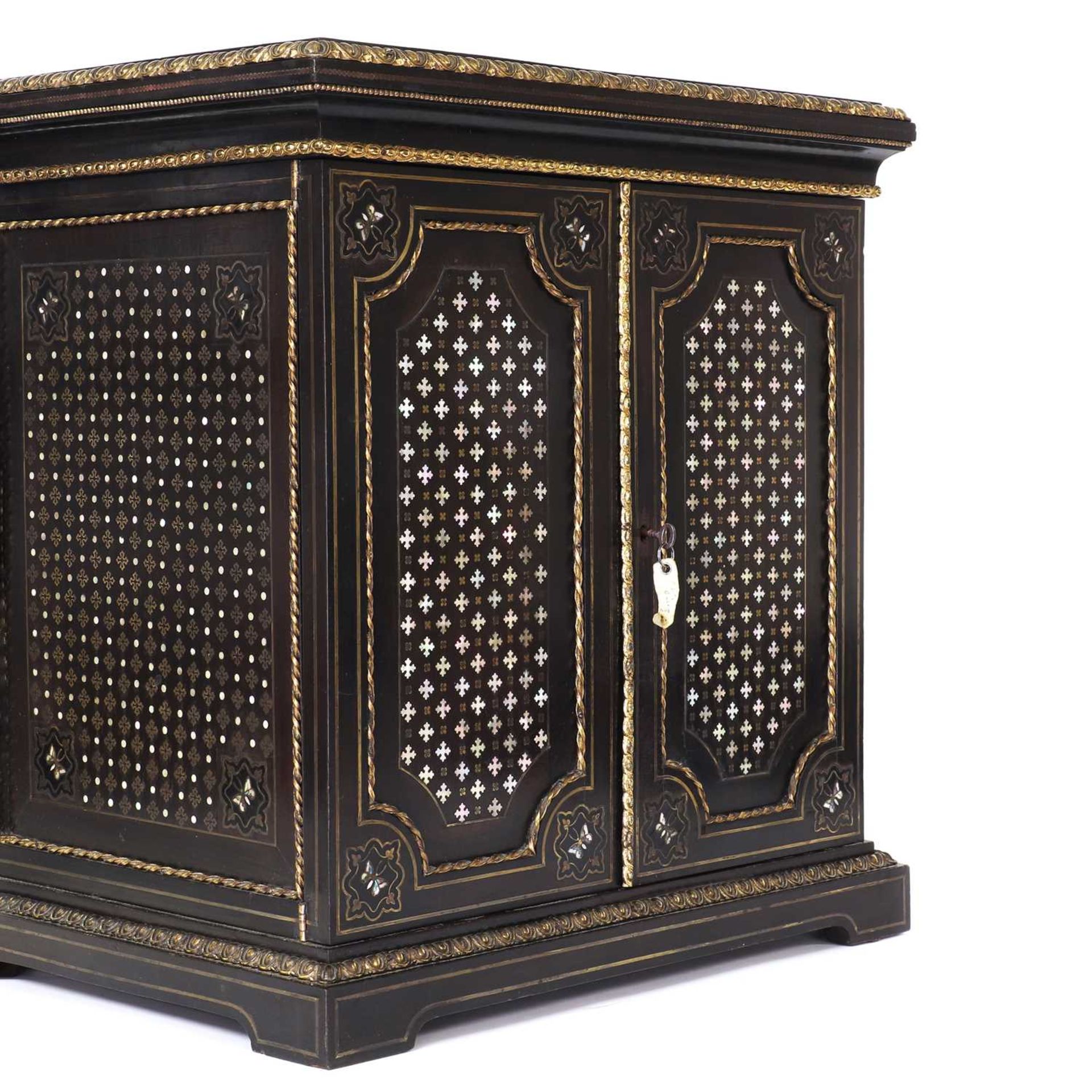 An ebony collector's cabinet,