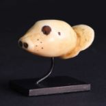 A Yupik Eskimo attachment in the form of a seal head,