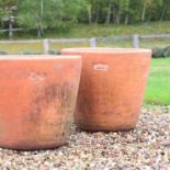 A pair of large terracotta planters,