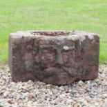 A sandstone planter,