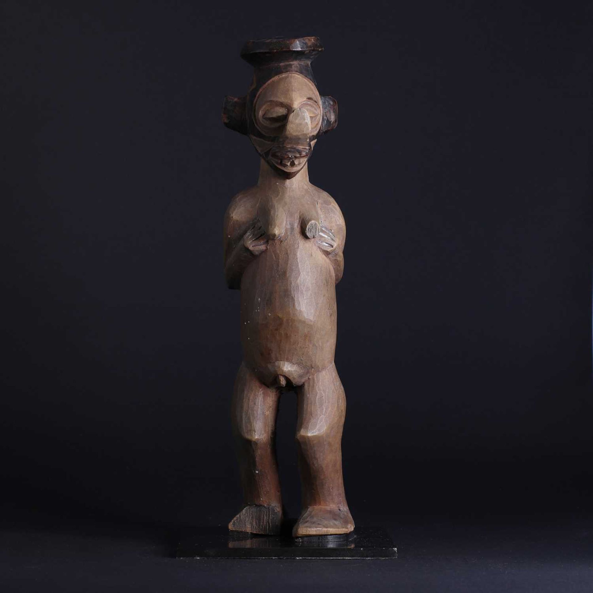 A Yaka People carved wood female figure,