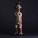 A Yaka People carved wood female figure,