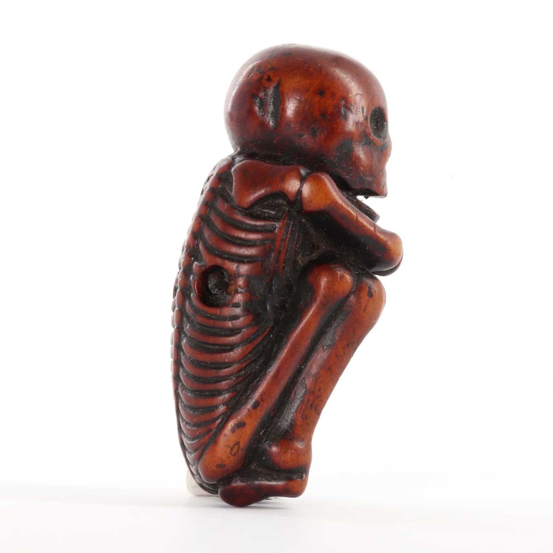 A Japanese carved boxwood netsuke depicting a skeleton, - Image 6 of 8