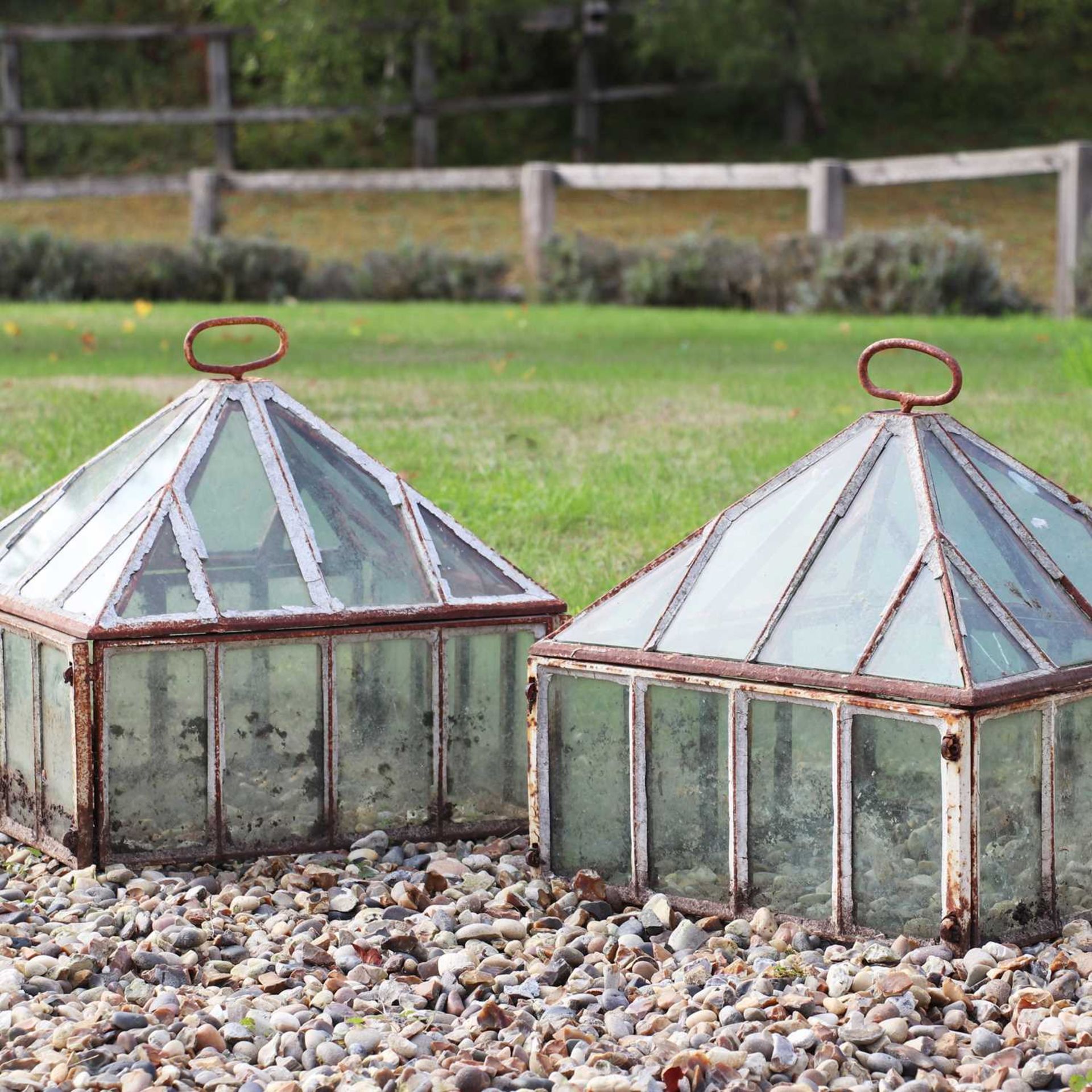 A pair of iron and glass lantern cloches,