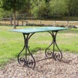 A wrought iron garden table,