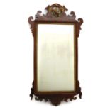 A George III mahogany fret cut mirror,