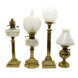 A group of four Victorian brass table lamps