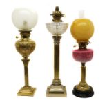 A group of three Victorian brass table lamps