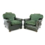 A pair of green leather club armchairs,