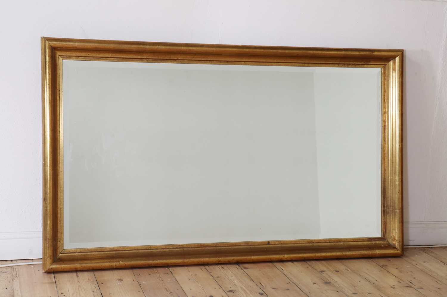 A contemporary gilt framed mirror