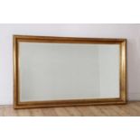 A contemporary gilt framed mirror