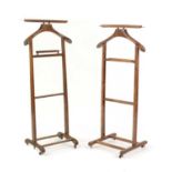 A pair of Italian stained beech valet stands,