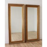 A large pair of gilt composite mirrors,