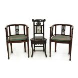 A pair of Chinese blackwood barrel-backed armchairs,