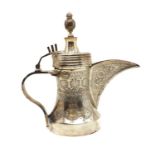 A silver Dallah coffee pot