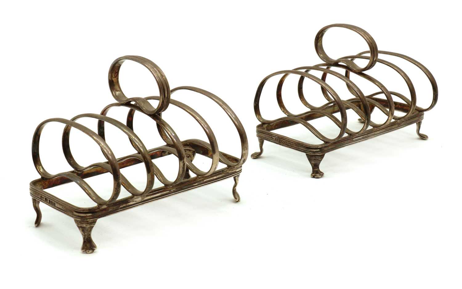 A pair of silver toast racks