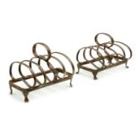 A pair of silver toast racks