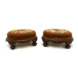 A pair of Victorian mahogany footstools