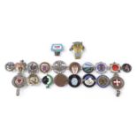 A collection of car badges,