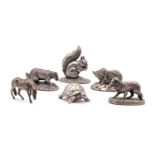A collection of silver animals,