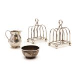 A pair of silver toast racks