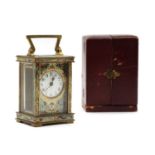 A French brass and champleve enamel carriage timepiece,