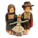 A pair of Edwardian bisque porcelain dolls,