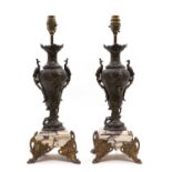 A pair of spelter vase form table lamps,