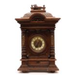 A large Victorian walnut clock,