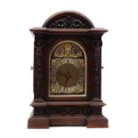 A large late Victorian oak mantel clock,