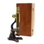 A cased monocular microscope
