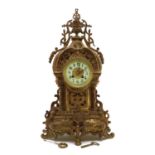 A cast patinated bronze mantel clock,