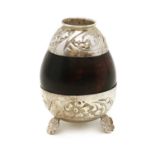 A coconut shell and silver mounted yerba mate cup