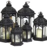 A group of five iron garden lanterns,