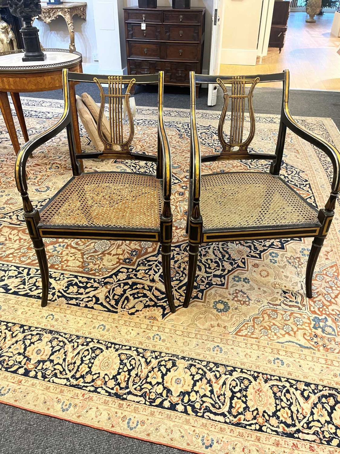 A pair of Regency ebonised and parcel-gilt armchairs, - Image 10 of 47