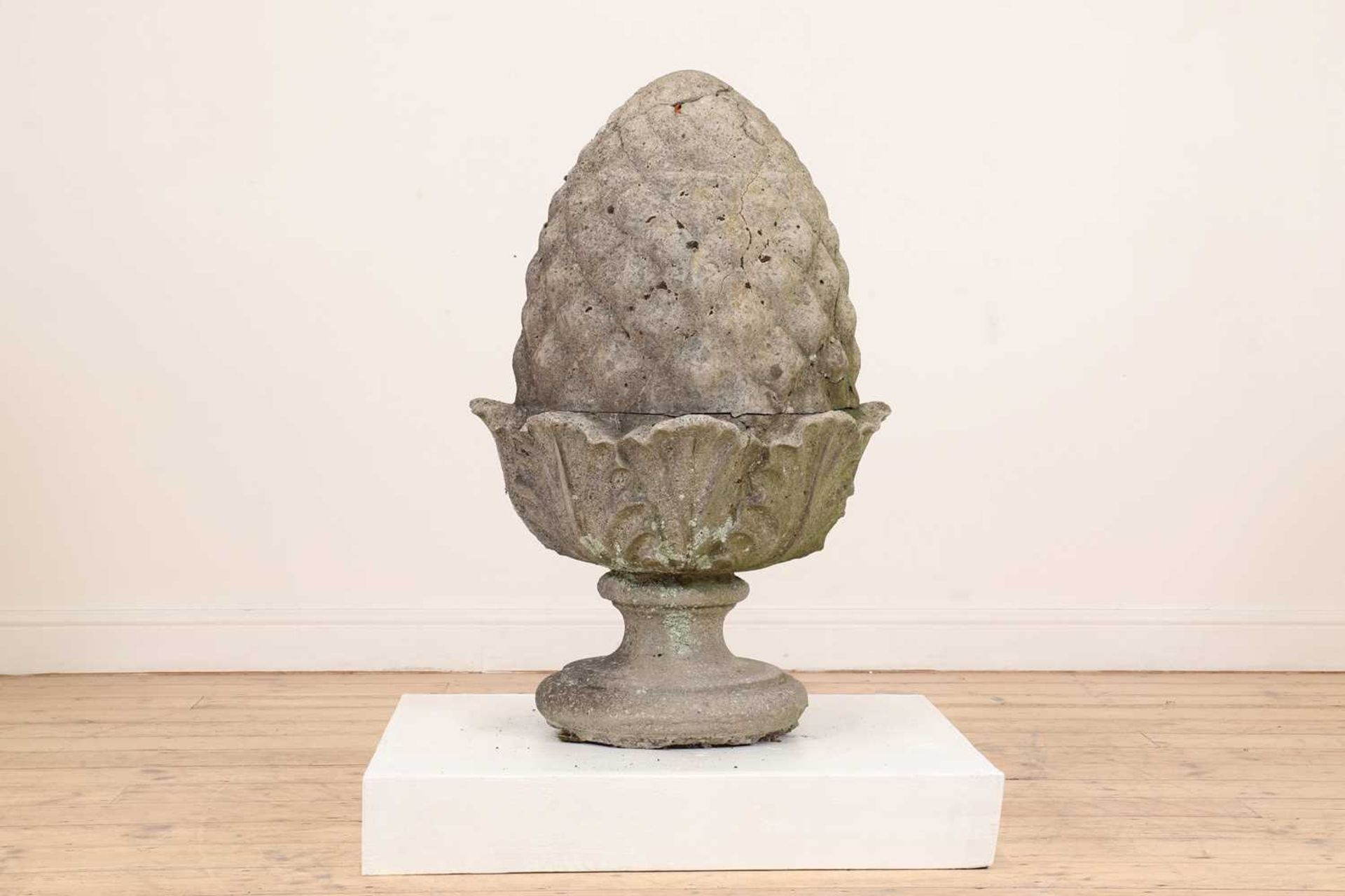 A composition stone pineapple finial,