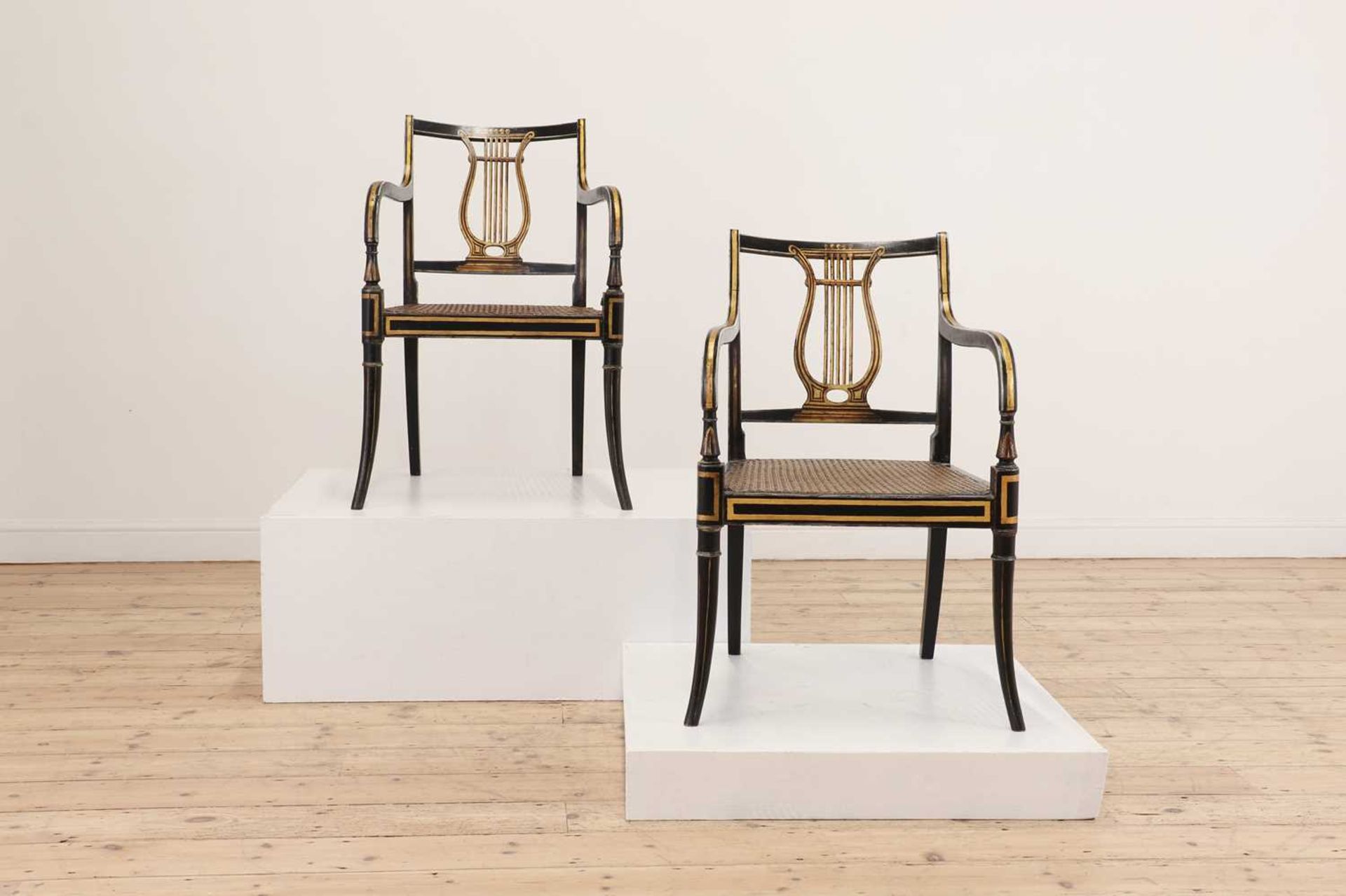 A pair of Regency ebonised and parcel-gilt armchairs, - Image 2 of 47