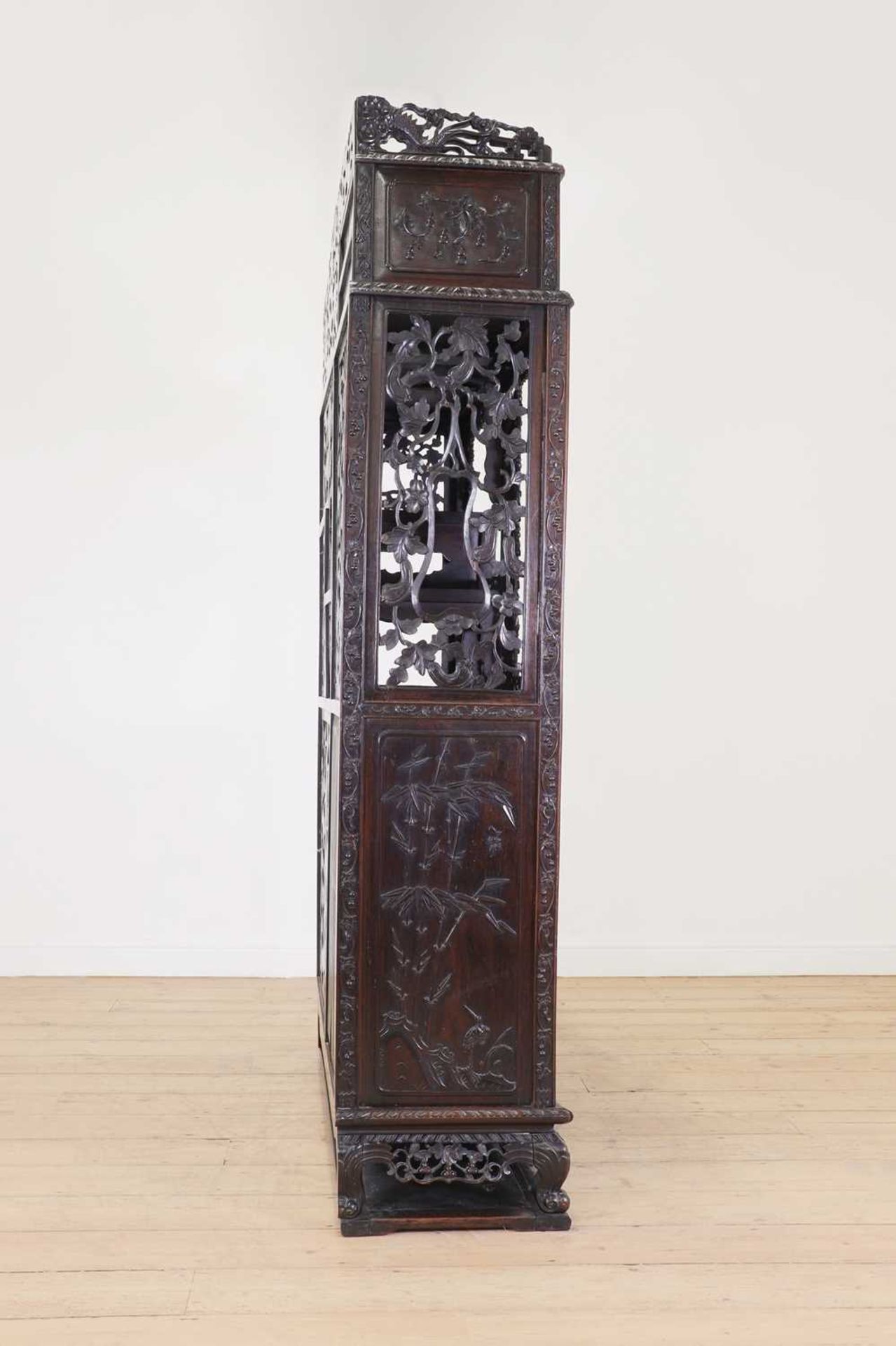 A carved and pierced hardwood cabinet, - Image 8 of 33