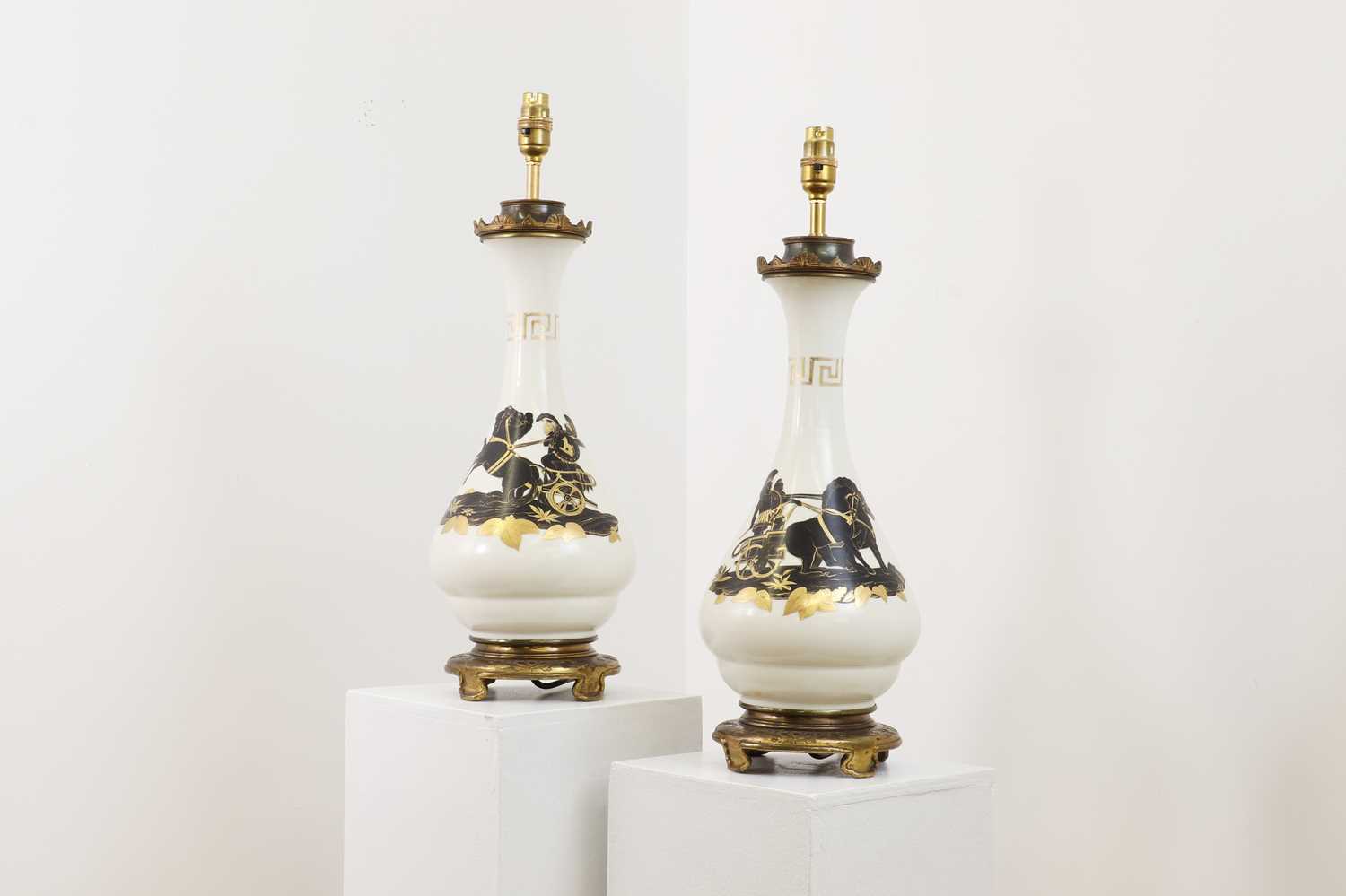A pair of gilt-metal-mounted vase lamps,