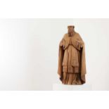 A carved limewood figure of a saint,