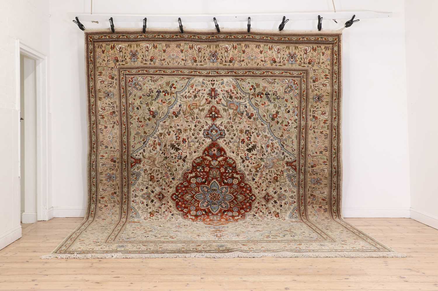 A Persian wool carpet,