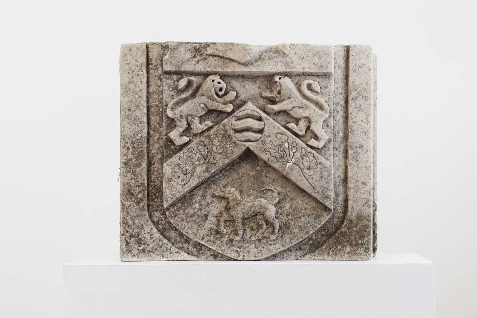 An heraldic carved sandstone architectural fragment,