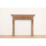 A George II-style carved pine fire surround,