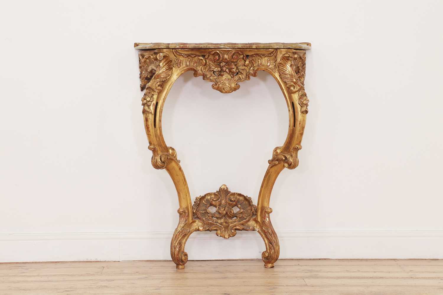 A carved giltwood pier table,