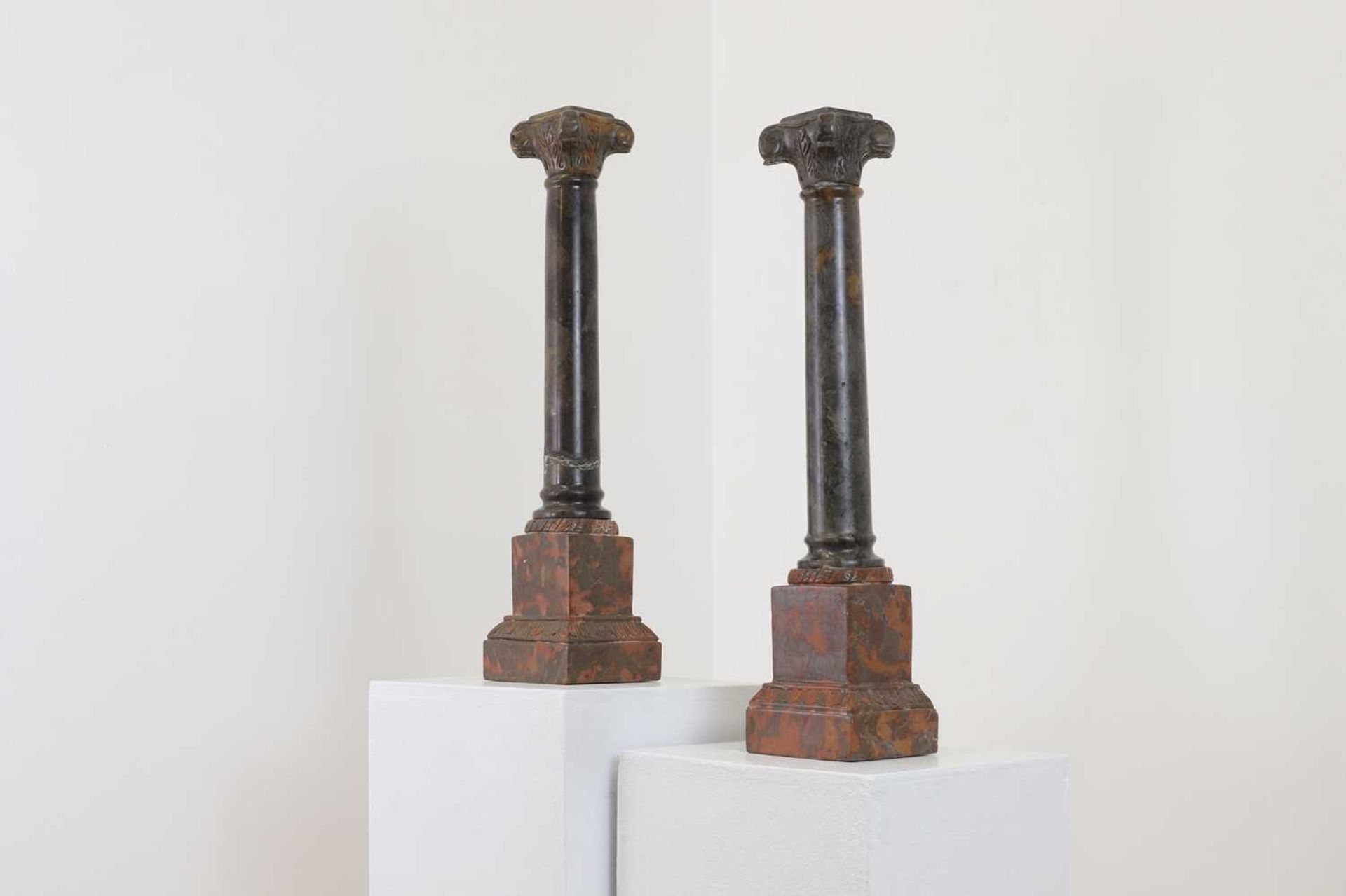 A pair of marble candlesticks,