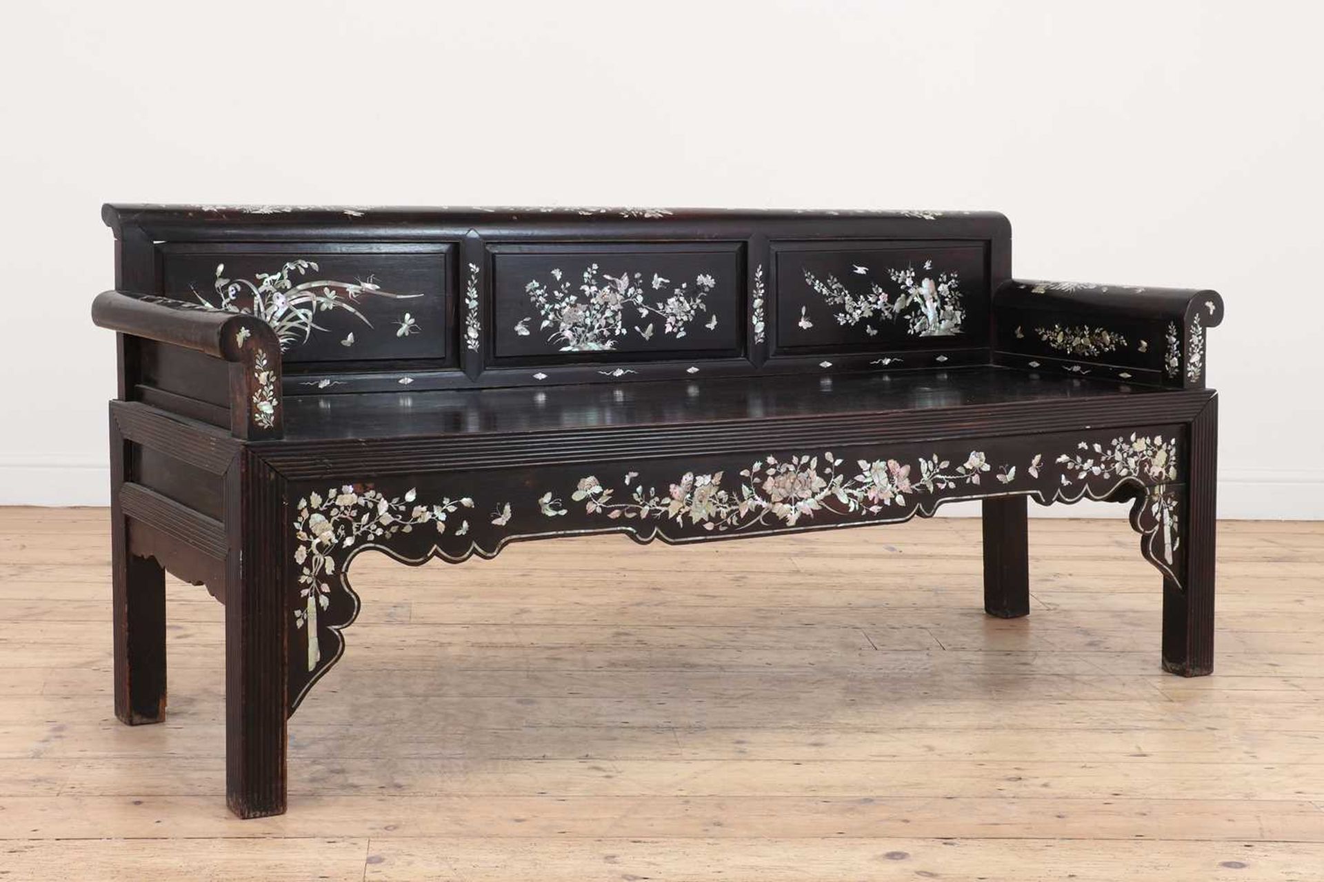 A hardwood and mother-of-pearl inlaid settee,